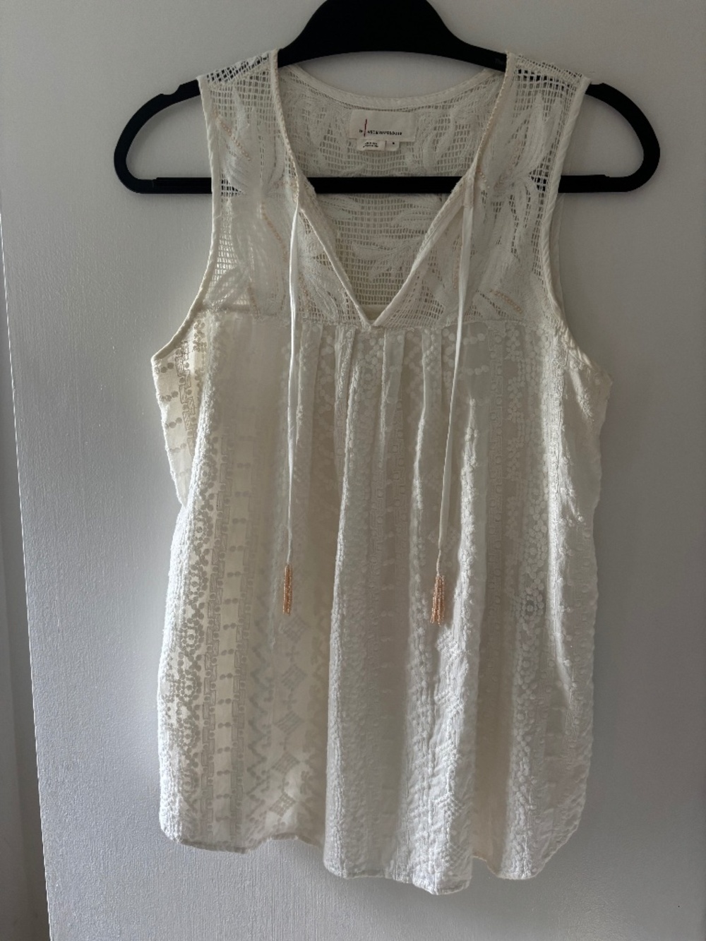 Flowy sleeveless Anthro top with Bohemian vibe